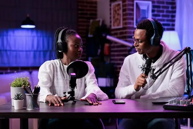 Campus Weekly team members in a podcast studio session